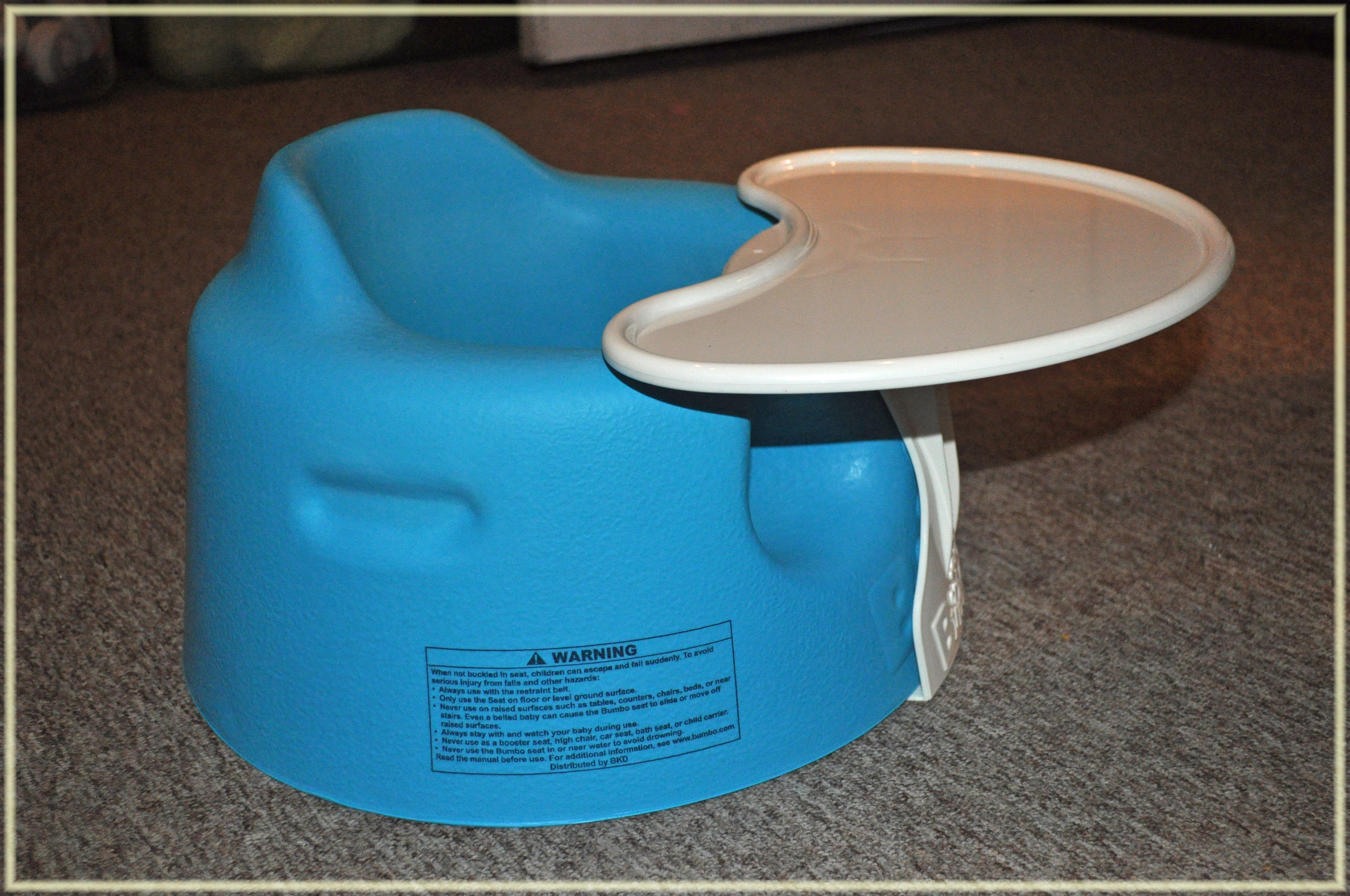 blue bumbo seat with tray